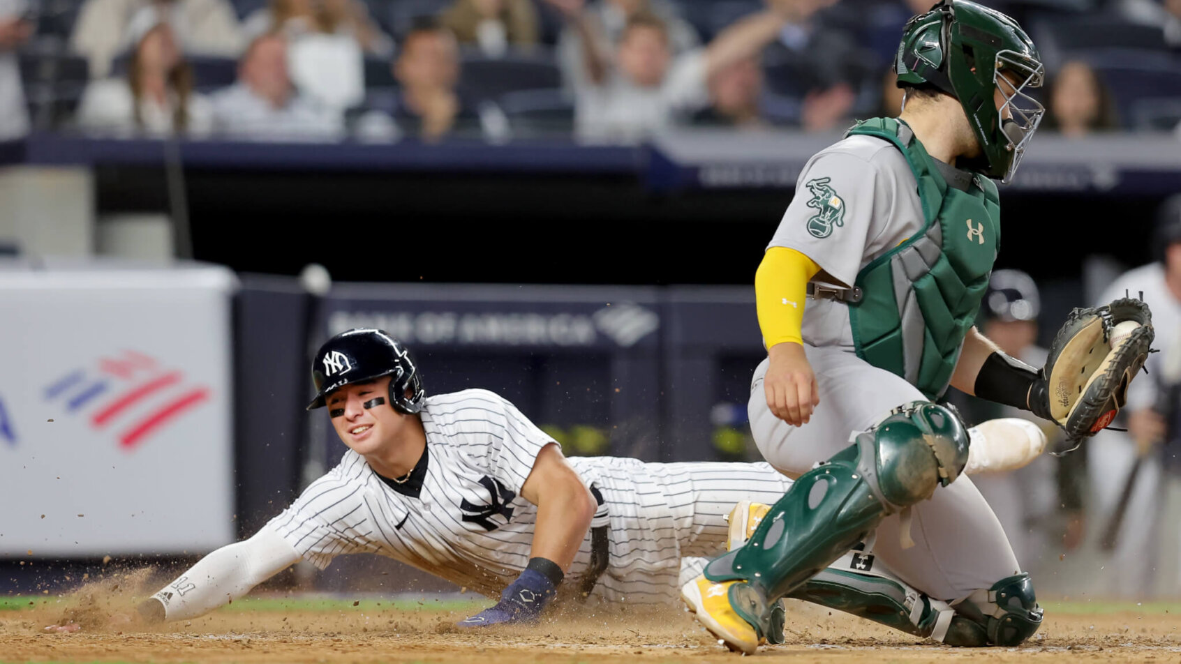 New York Yankees shortstop Anthony Volpe slides into home