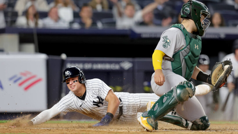 New York Yankees shortstop Anthony Volpe slides into home
