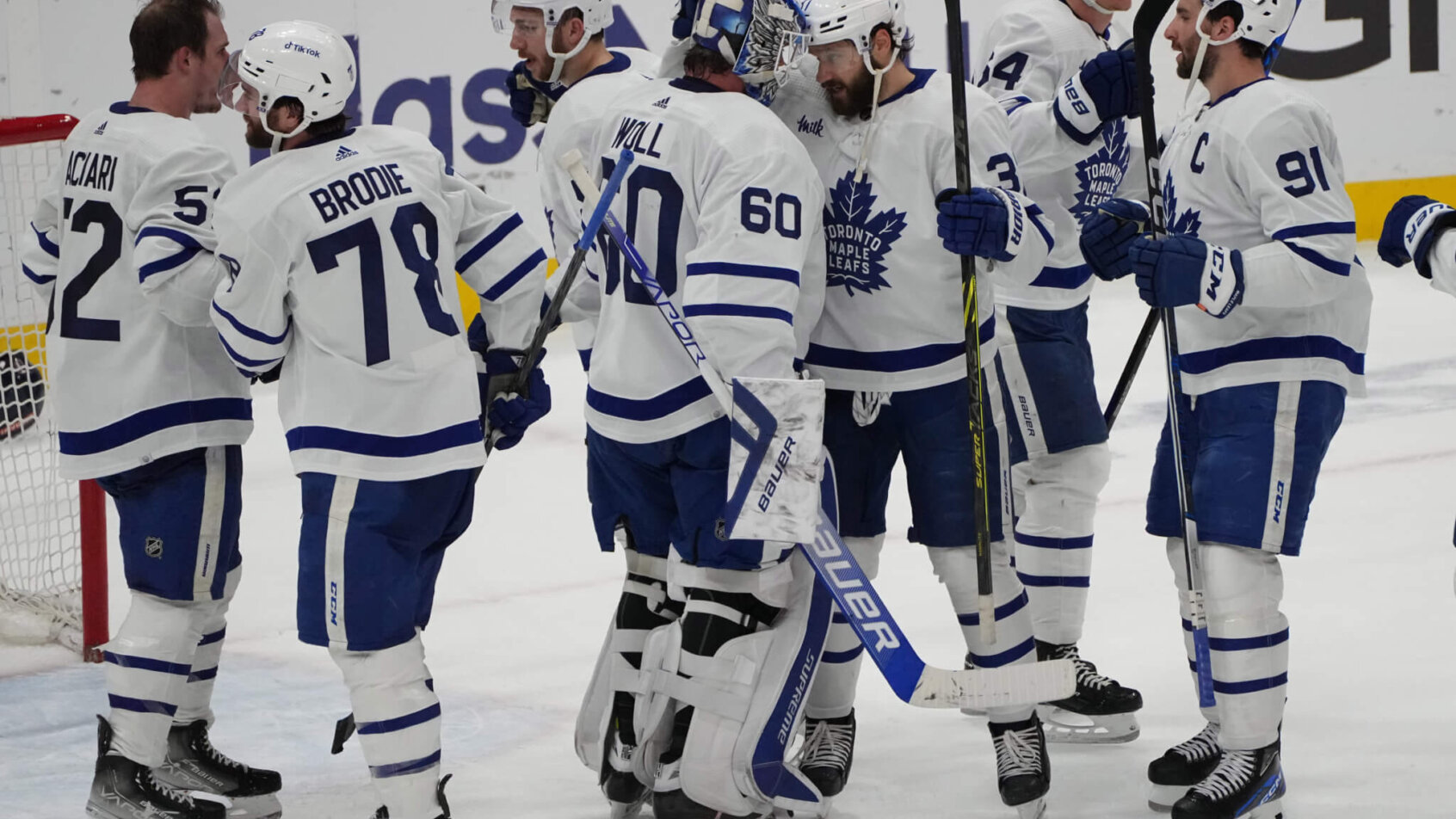 Toronto Maple Leafs goaltender Joseph Woll celebrates victory with teammates against Florida Panthers