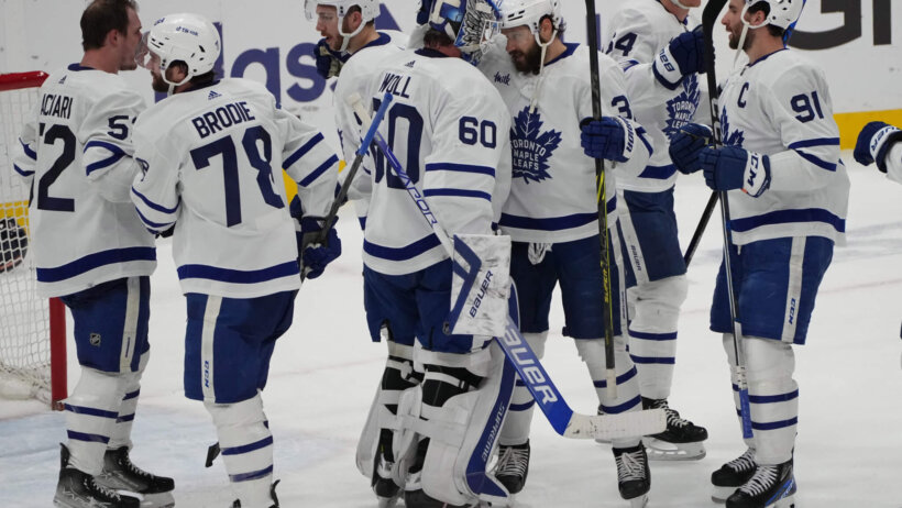 Toronto Maple Leafs goaltender Joseph Woll celebrates victory with teammates against Florida Panthers