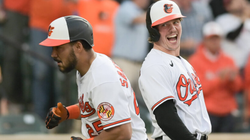 Baltimore Orioles right fielder Anthony Santander celebrates with catcher Adley Rutschman