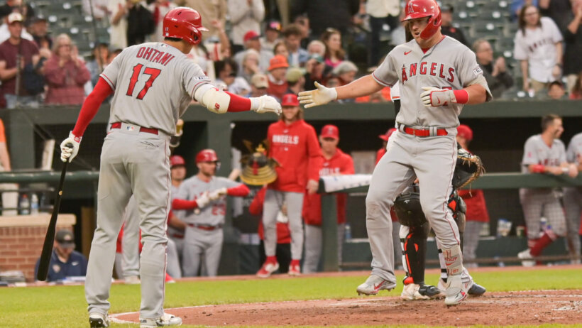 Mike Trout high-fiving Shohei Ohtani