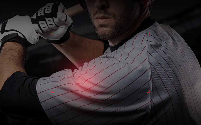 Baseball player holding bat white jersey red stripes