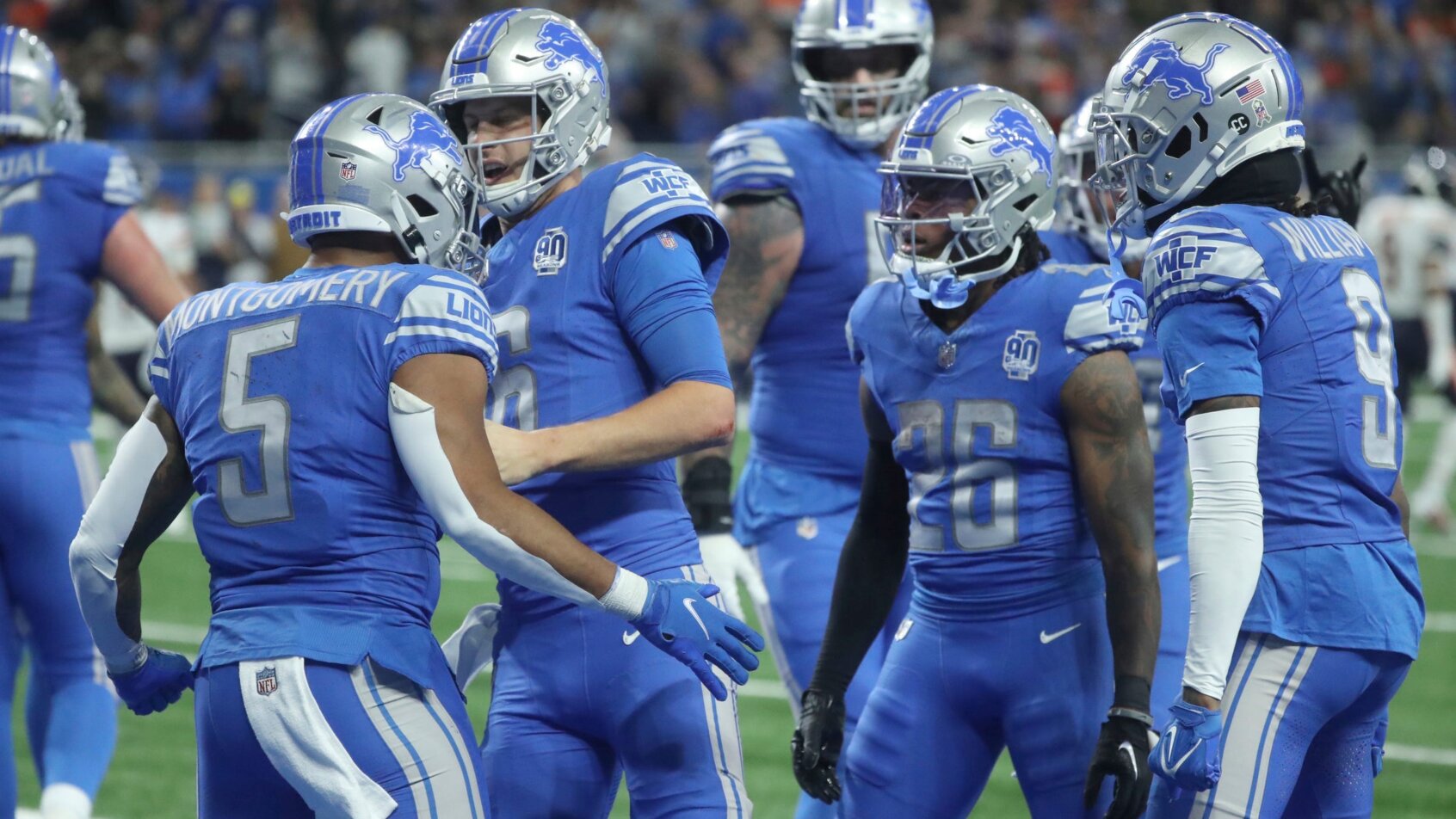 Detroit Lions players celebrate after scoring a touchdown
