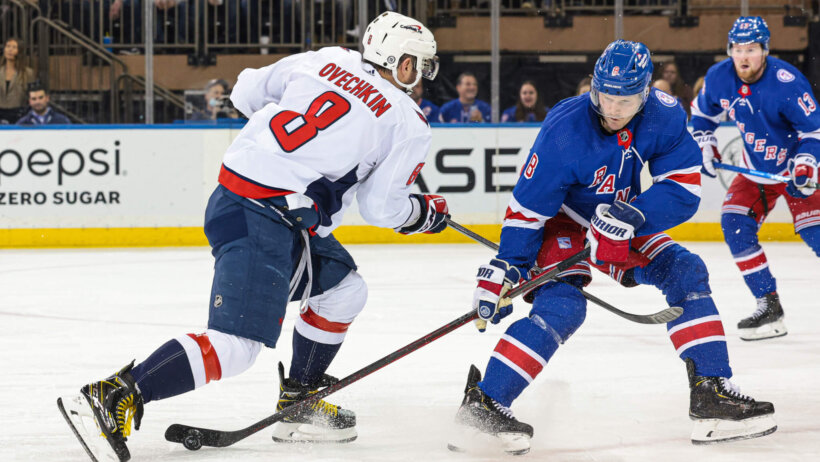 New York Rangers defenseman Jacob Trouba tips the puck away from Washington Capitals left wing Alex Ovechkin during the second period at Madison Square Garden