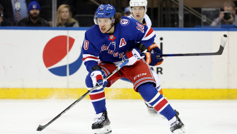New York Rangers left wing Artemi Panarin controls the puck against New York Islanders right wing Oliver Wahlstrom