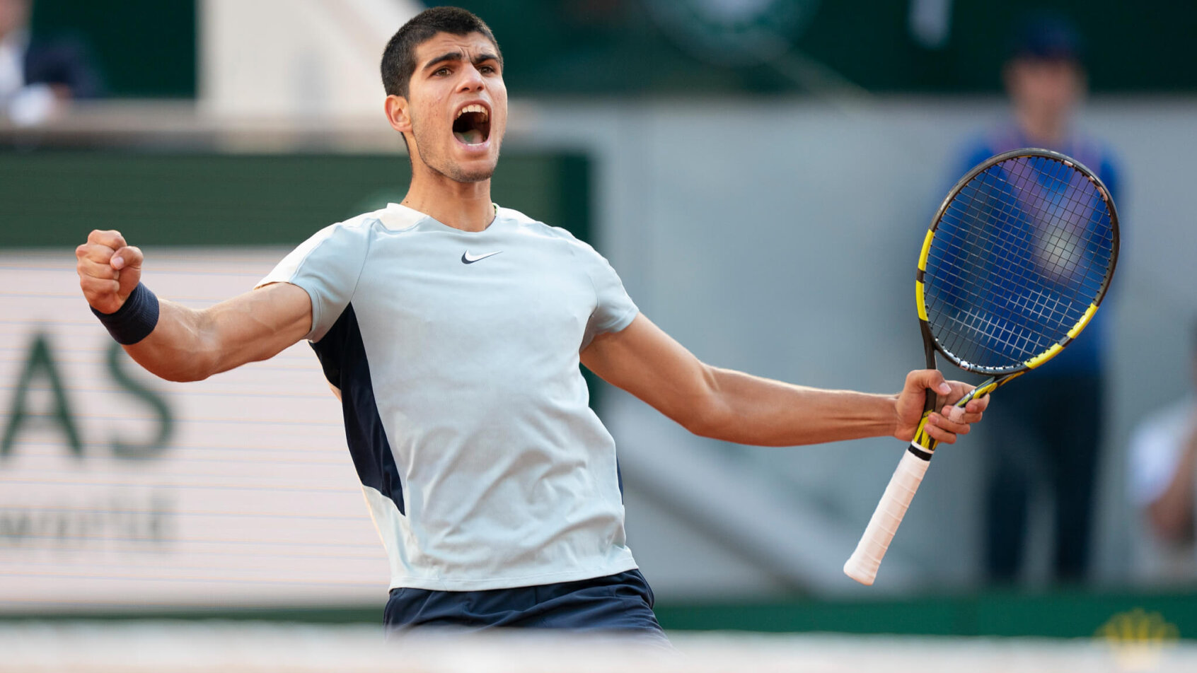Carlos Alcaraz celebrates at the French Open