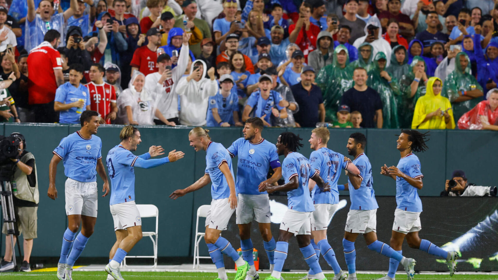 Manchester City FC celebrates after scoring a goal.