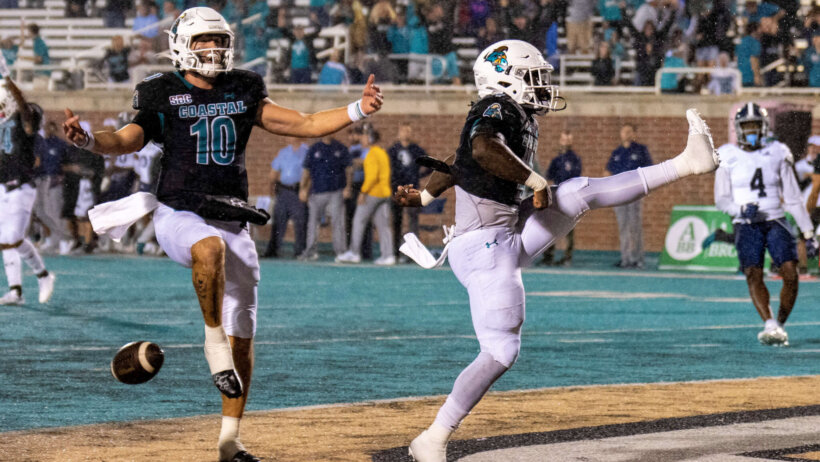 Coastal Carolina Chanticleers quarterback Grayson McCall and Coastal Carolina Chanticleers running back CJ Beasley celebrate a late 4th quarter touchdown