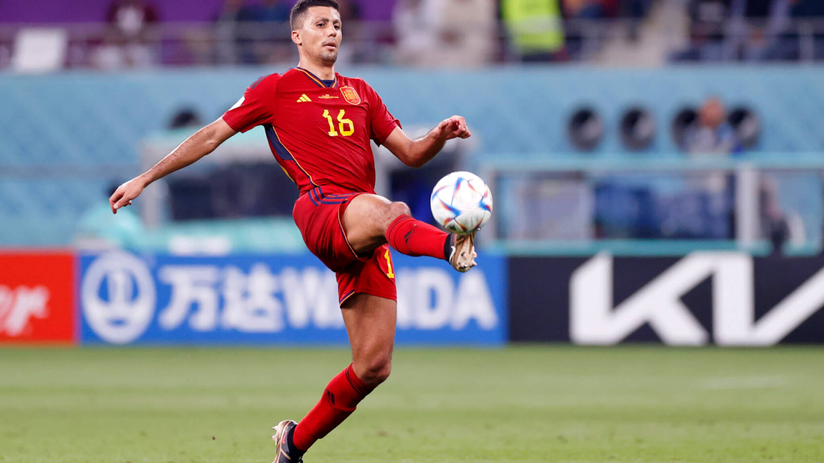 Spain midfielder Rodri tries to control the ball