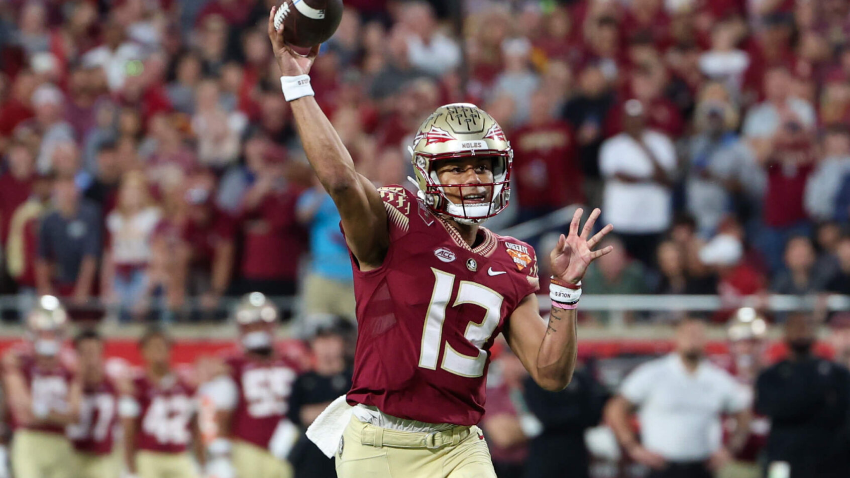 Florida State Seminoles quarterback Jordan Travis drops back to pass