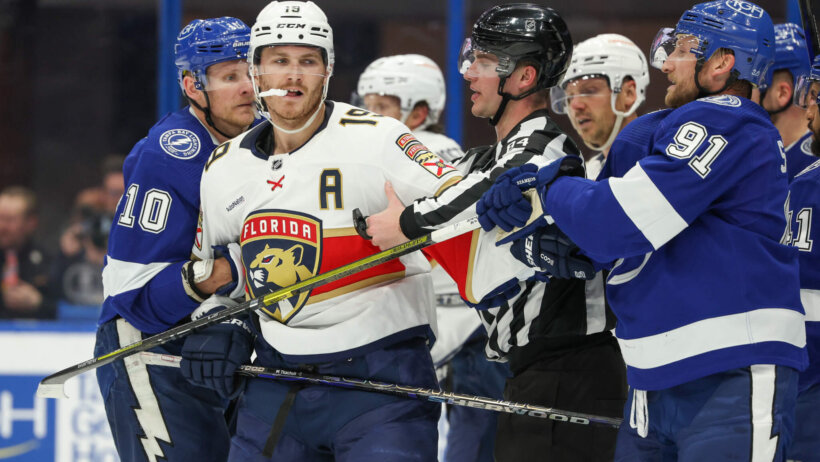 Tampa Bay Lightning enter Steven Stamkos holds back Florida Panthers left wing Matthew Tkachuk