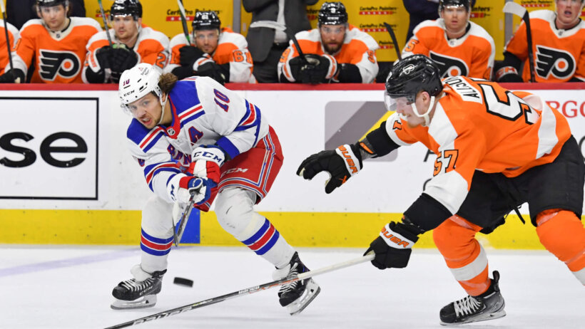 New York Rangers left wing Artemi Panarin is defended by Philadelphia Flyers right wing Wade Allison