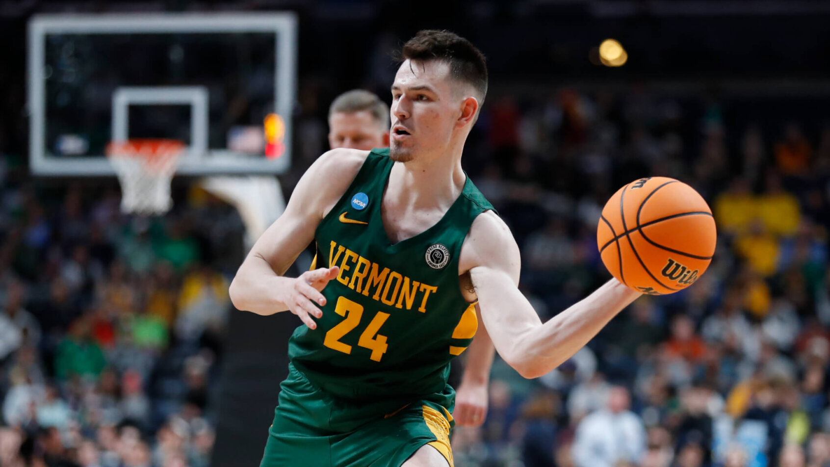 Vermont Catamounts basketball player ball in hand