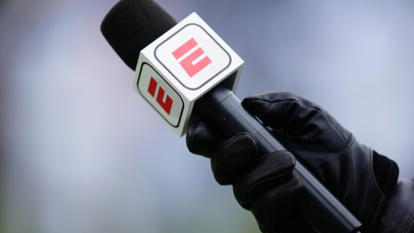 ESPN microphone hand holding black glove