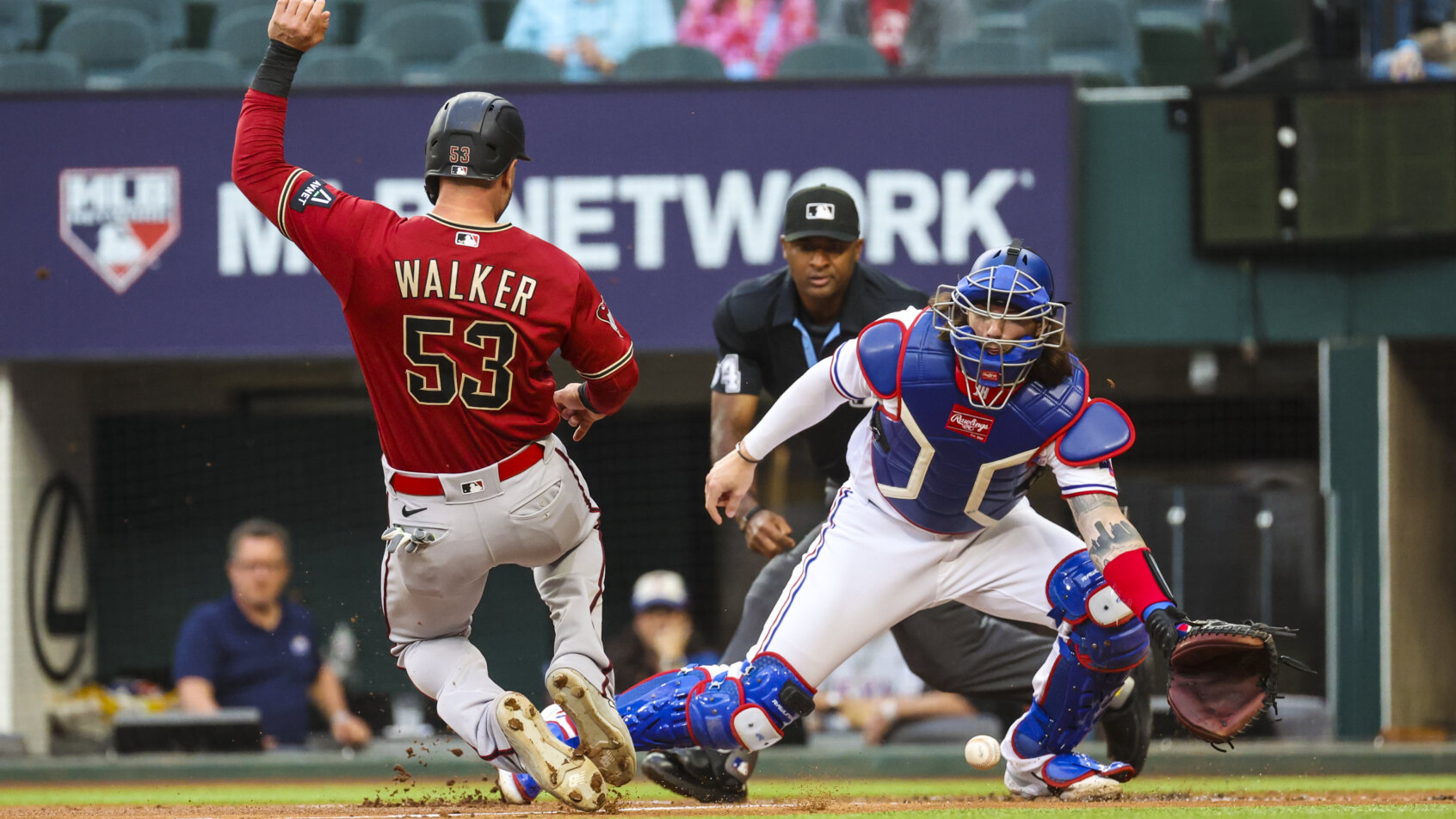 Arizona Diamondbacks first baseman Christian Walker scoring a run against the Texas Rangers