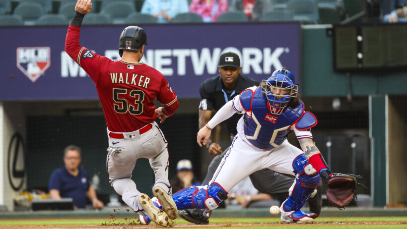 Arizona Diamondbacks first baseman Christian Walker scoring a run against the Texas Rangers
