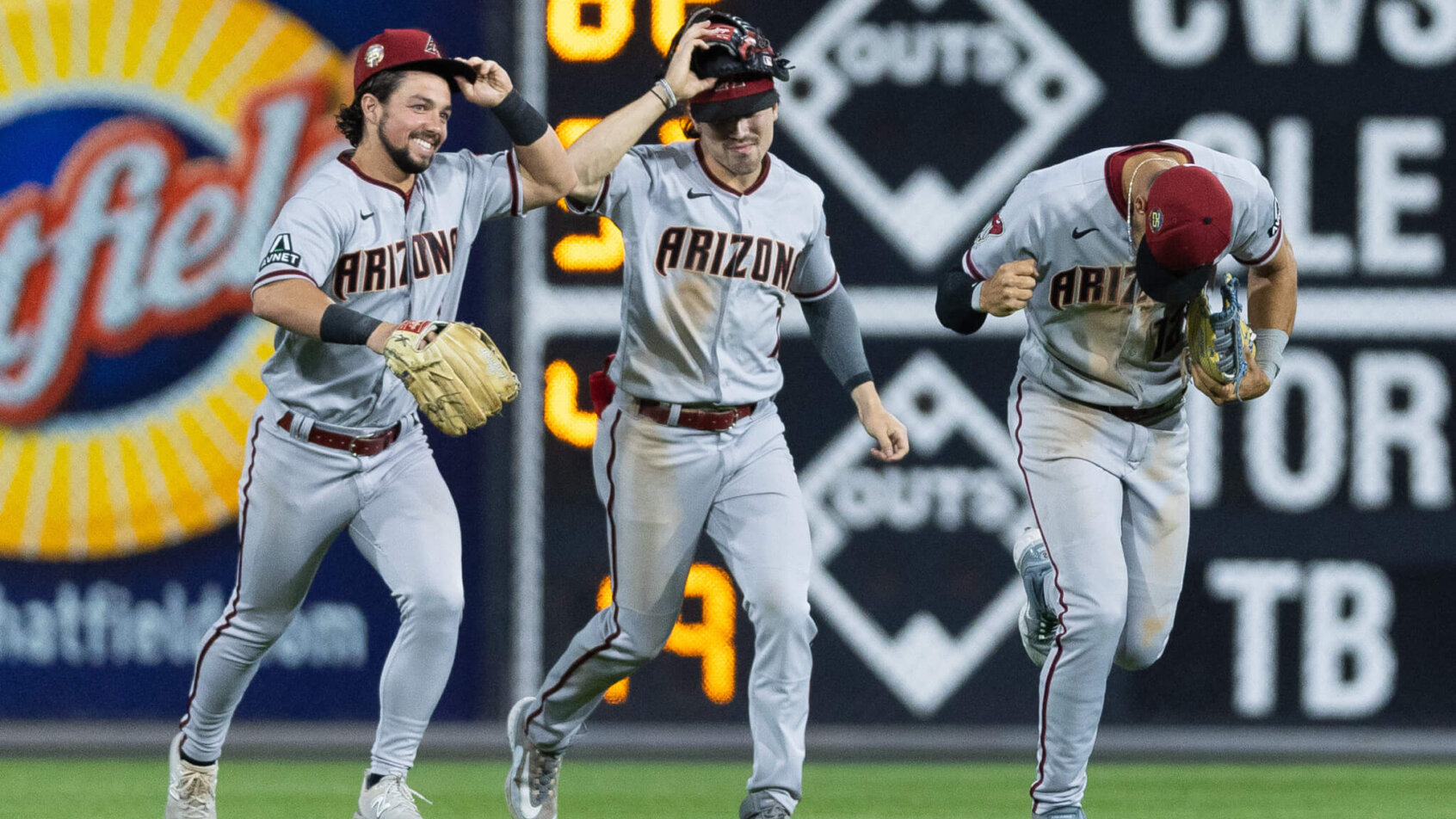 Arizona Diamondbacks outfielders celebrating a win