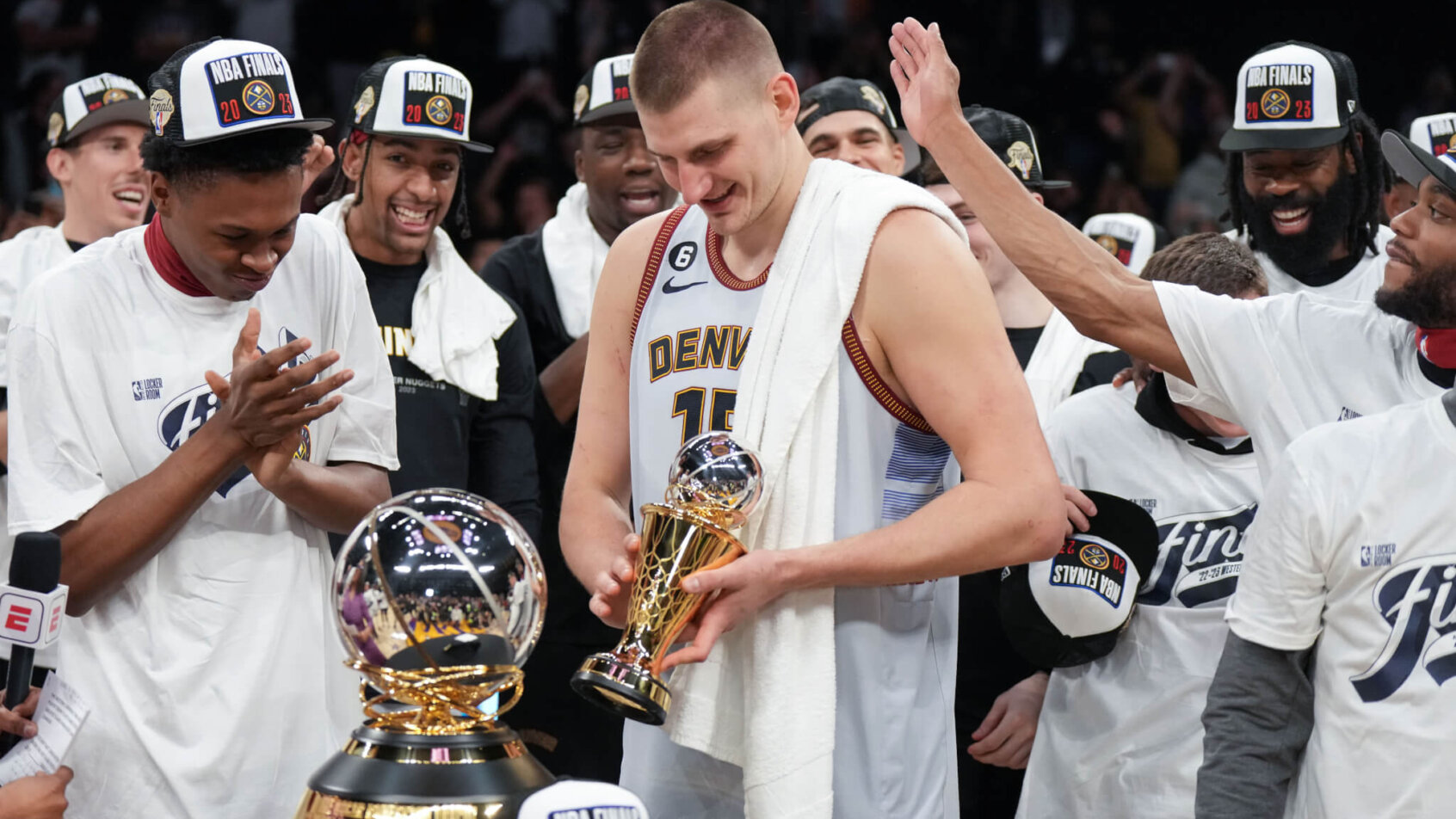 Nikola Jokic and the Denver Nuggets celebrating their Western Conference Finals win.
