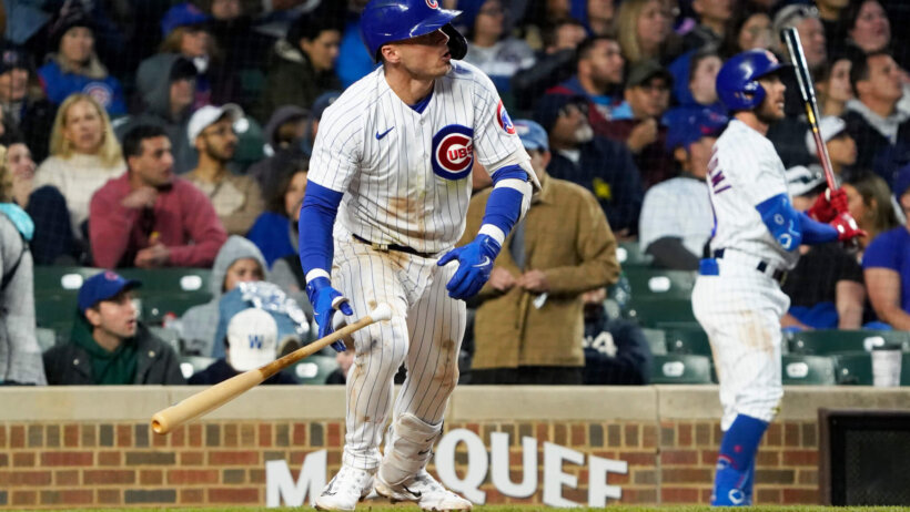Chicago Cubs second baseman Nico Hoerner watches a hit