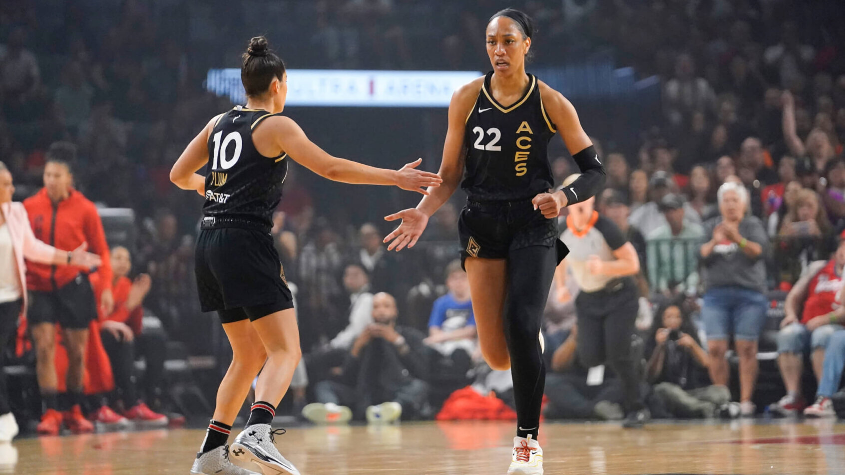 Las Vegas Aces forward Aja Wilson (22) celebrates with guard Kelsey Plum (10) after scoring against the Minnesota Lynx