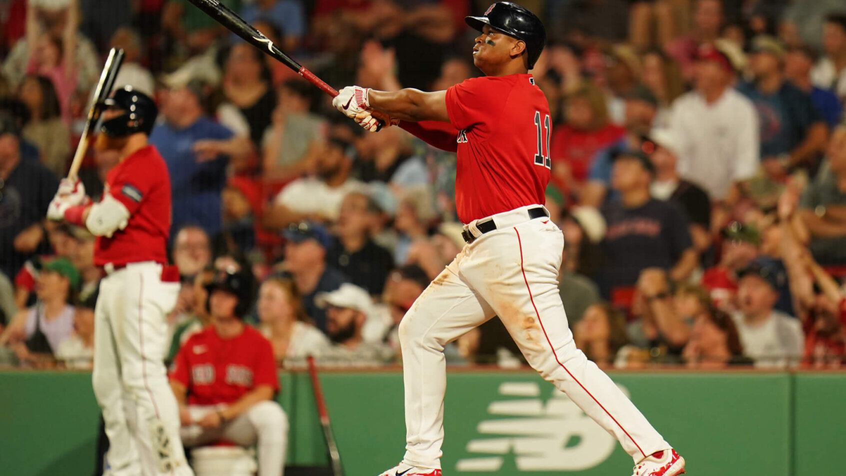 Boston Red Sox third baseman Rafael Devers hitting a double