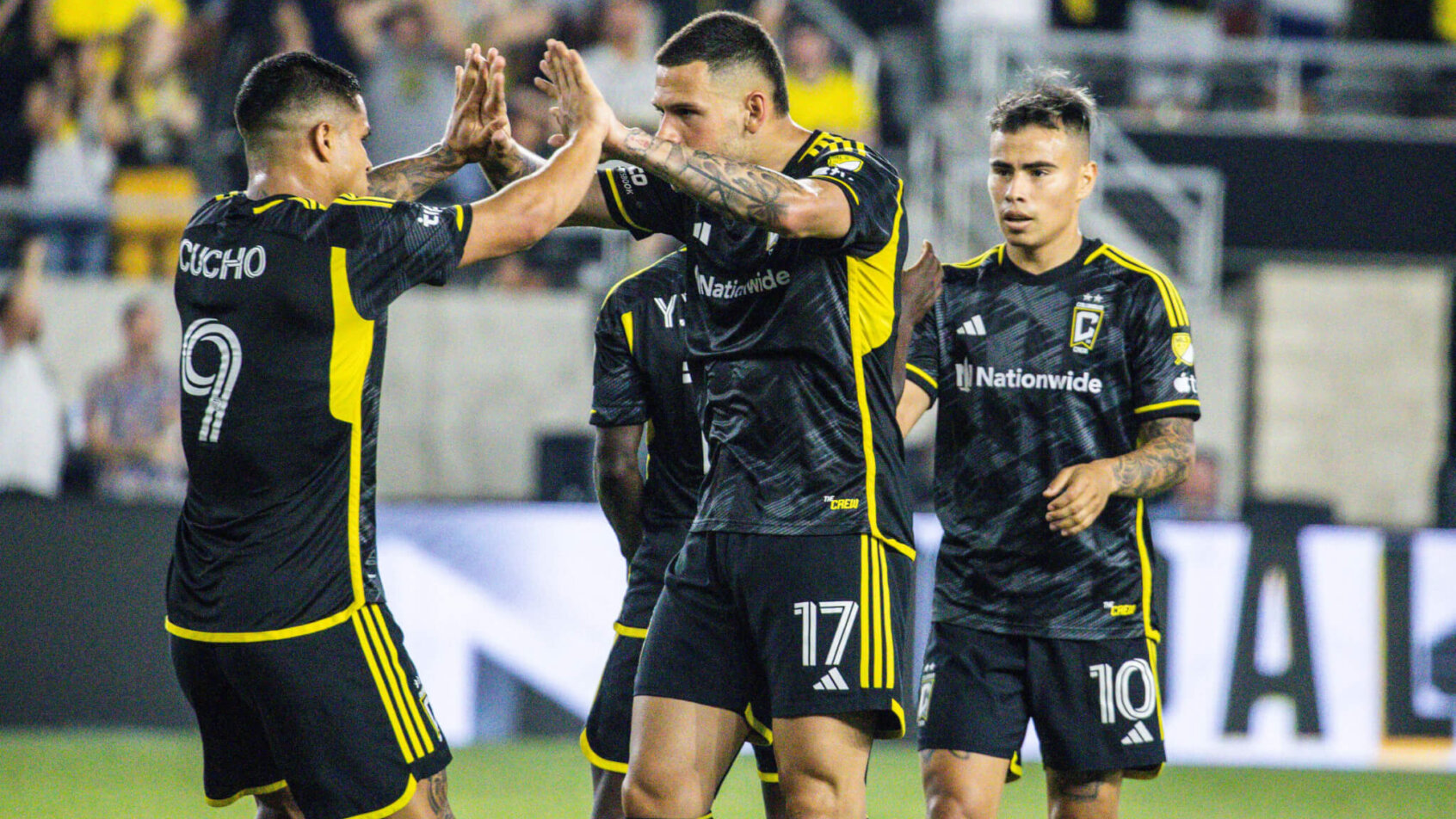 Columbus Crew forward Christian Ramirez (17) celebrates his second goal with forward Cucho Hernandez (9)