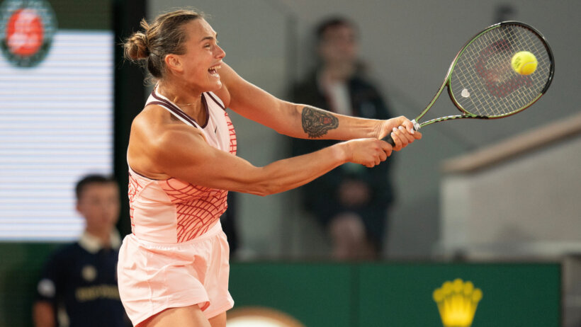 Aryna Sabalenka smashes a return in French Open play