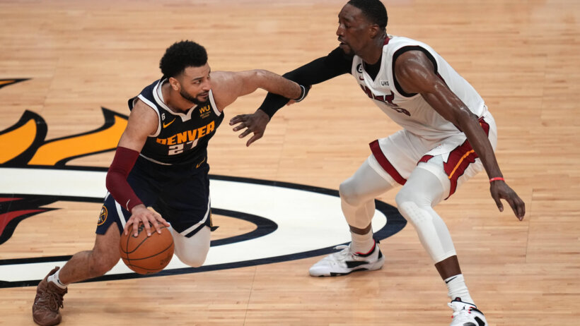 Nuggets guard Jamal Murray drives against Heat big man Bam Adebayo.