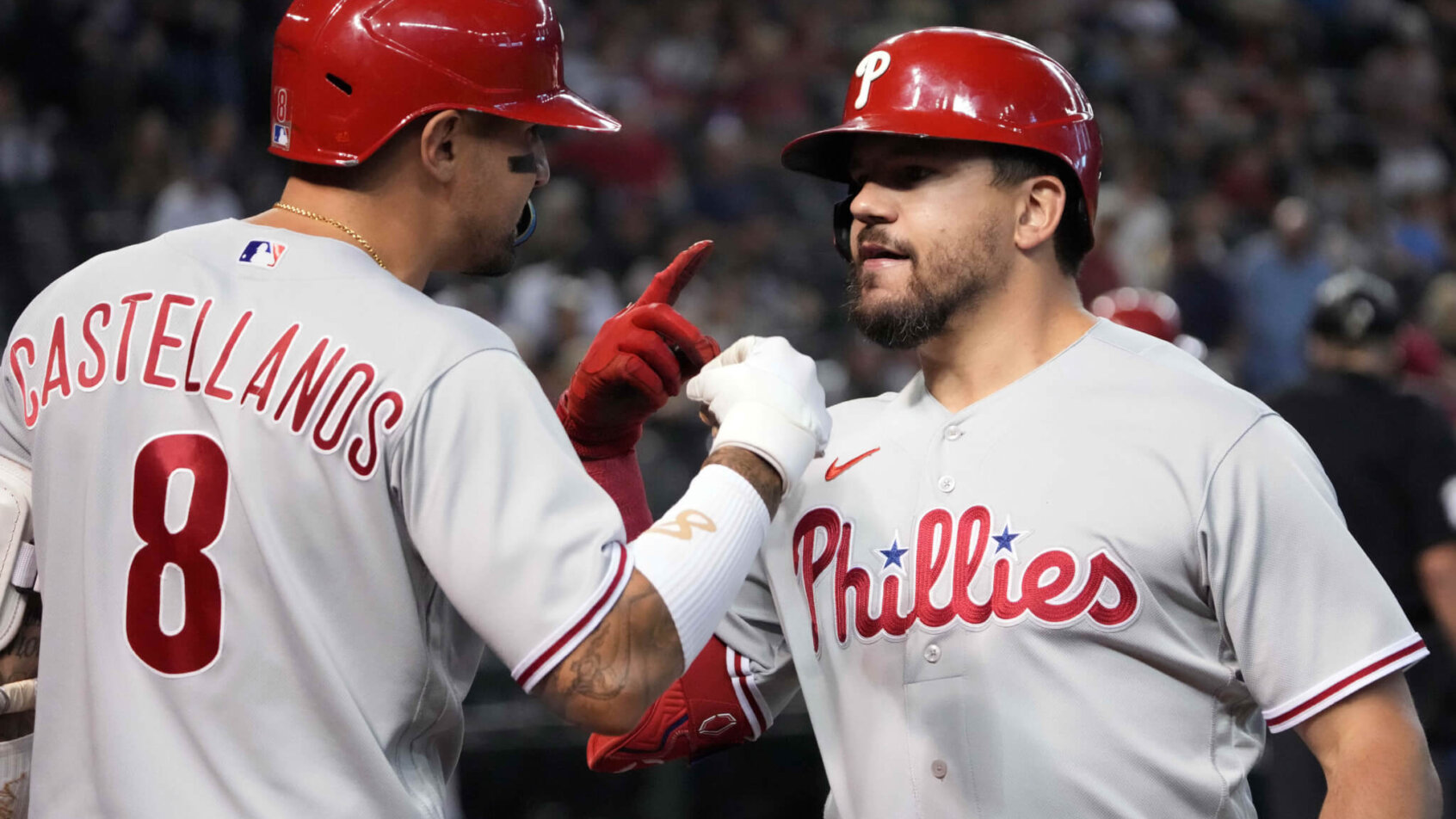 Kyle Schwarber celebrates with Nick Castellanos
