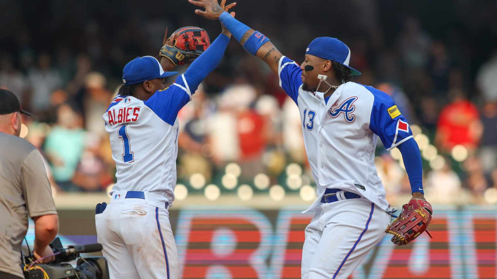 Ozzie Albies (1) and right fielder Ronald Acuna Jr. Rockies vs Braves