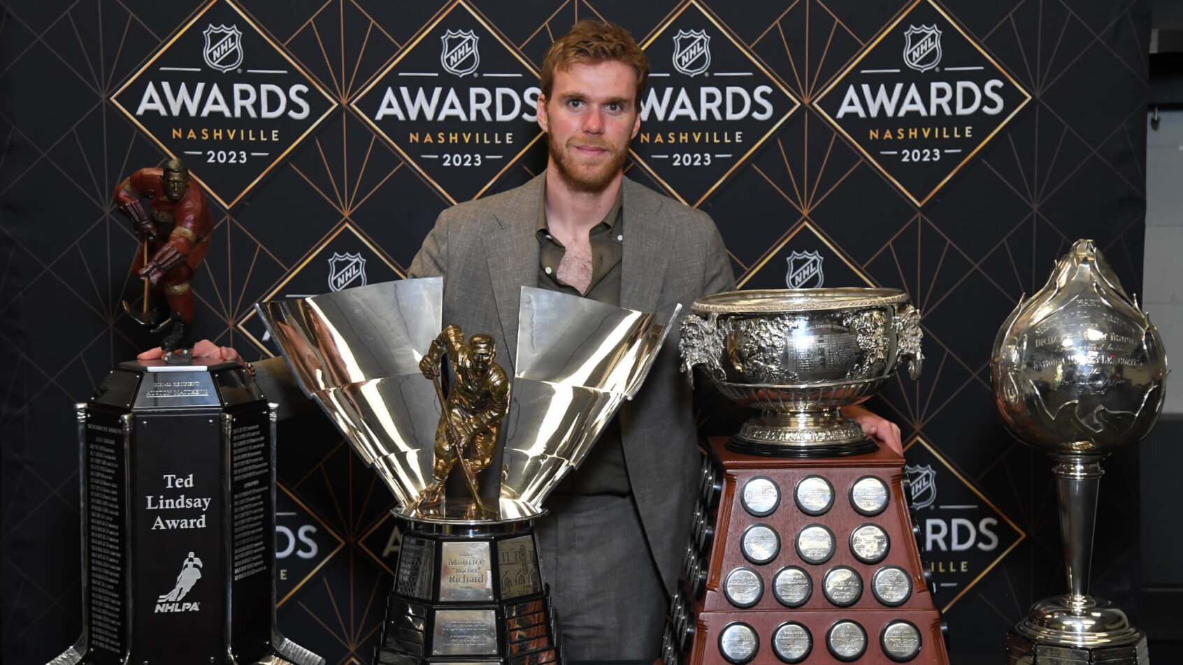 Edmonton Oilers center Connor McDavid poses with NHL awards