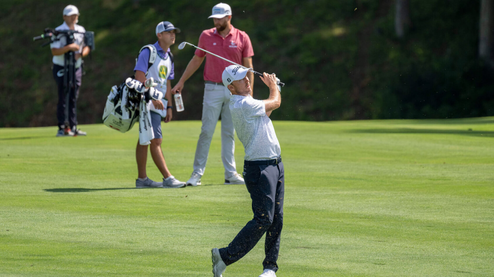 Russell Henley hits his approach shot on the first hole during the first round of the John Deere Classic.