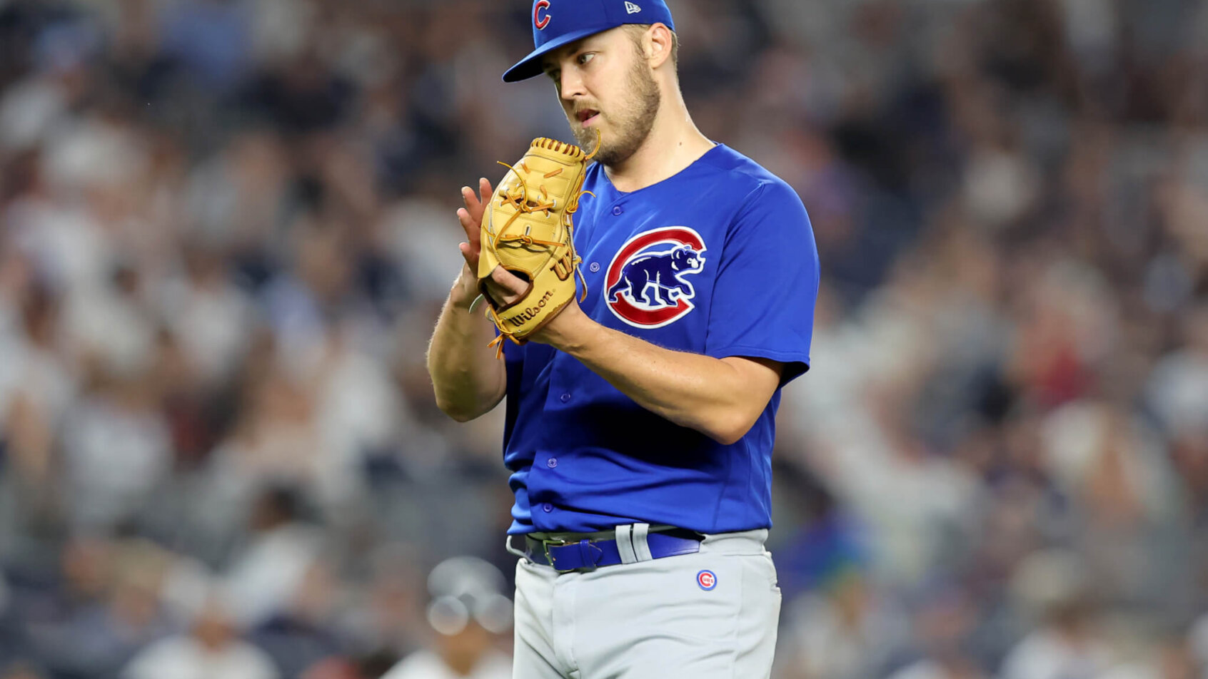 Jameson Taillon looking at glove