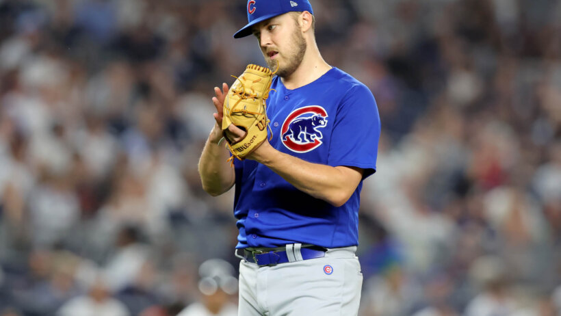 Jameson Taillon looking at glove