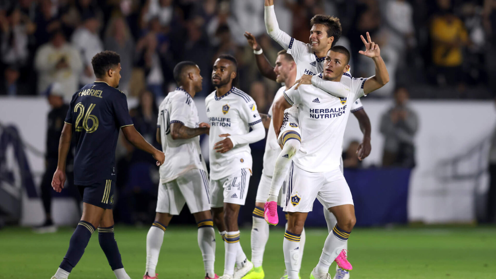 Los Angeles Galaxy midfielder Riqui Puig (6) celebrates with forward Dejan Joveljic