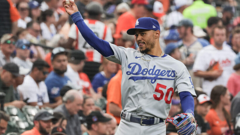 Los Angeles Dodgers right fielder Mookie Betts throwing the ball