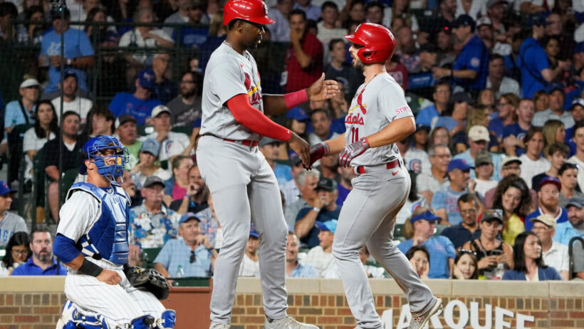 St. Louis Cardinals shortstop Paul DeJong celebrates with right fielder Jordan Walker