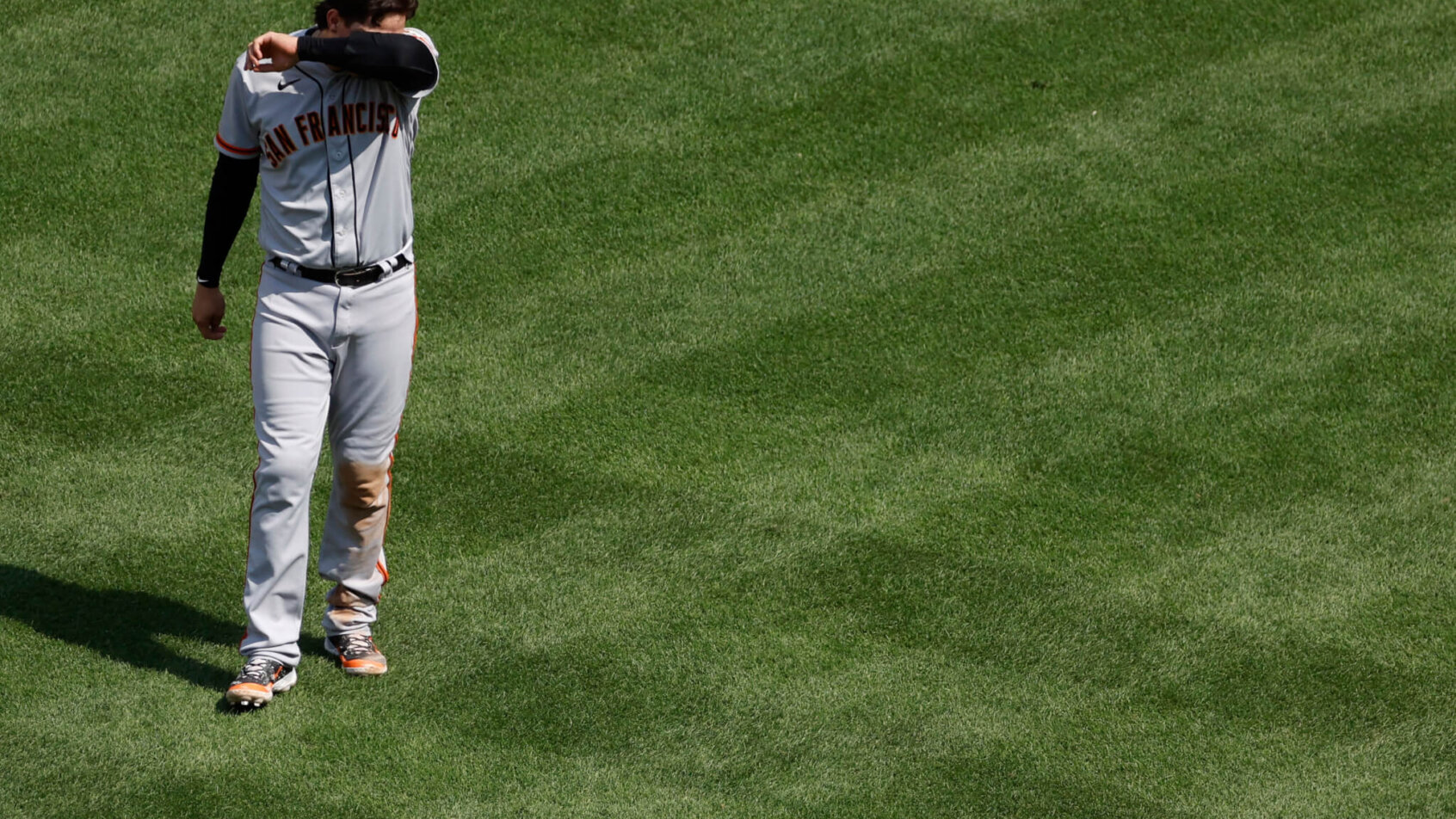 San Francisco Giants first baseman Wilmer Flores walking off the field