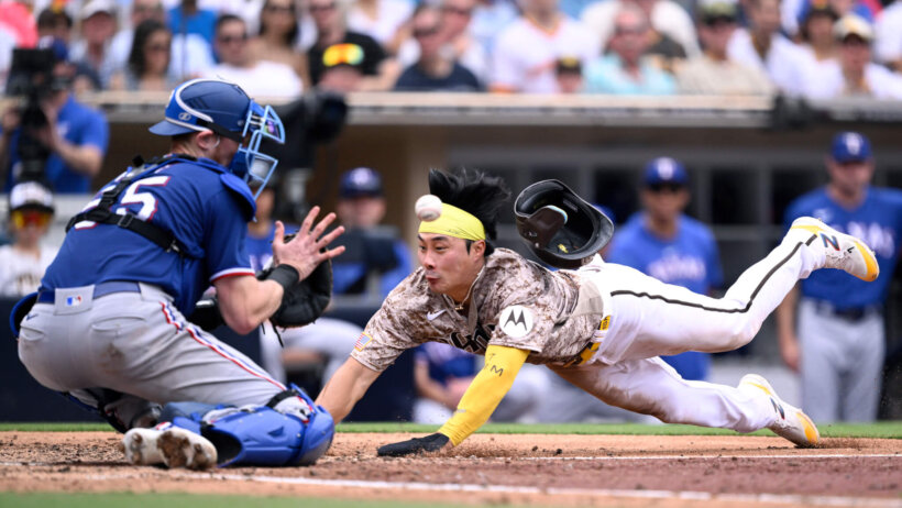 Ha-seong Kim scores a run against the Texas Rangers.