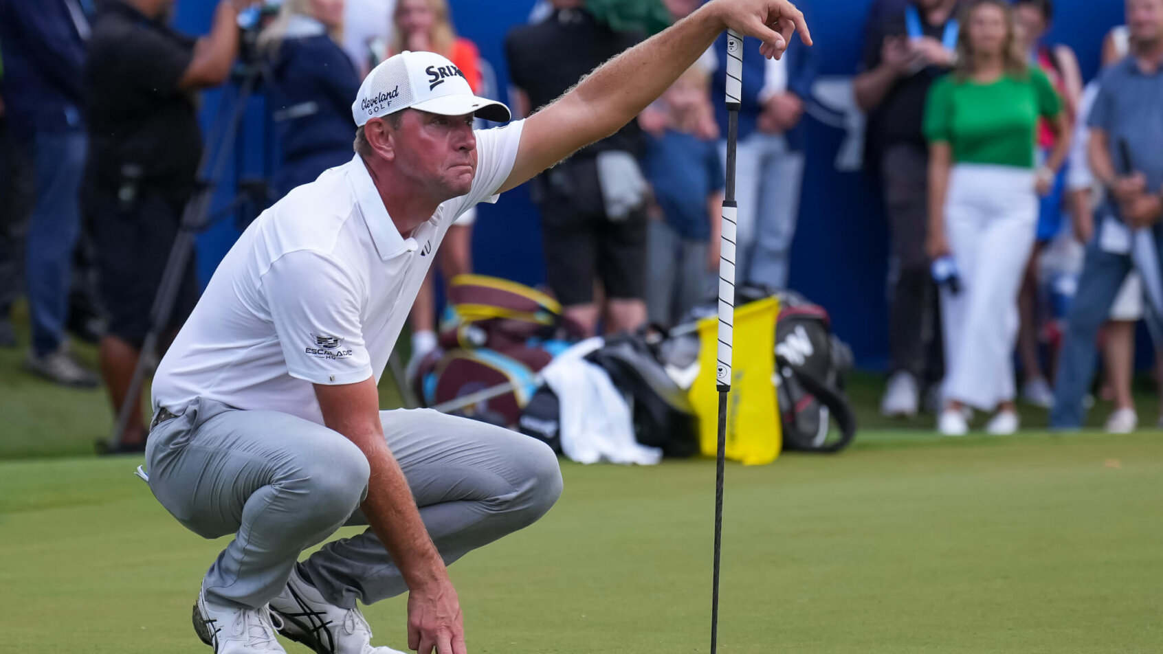 Lucas Glover lines up a putt at the Wyndham Championship.