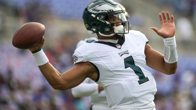 Philadelphia Eagles quarterback Jalen Hurts warms up before the game