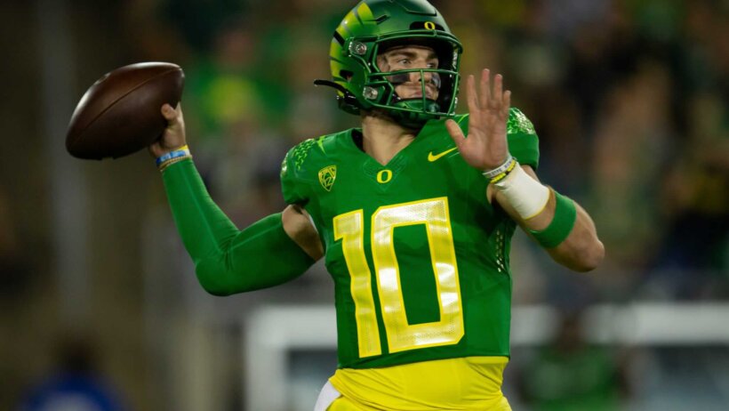Oregon quarterback Bo Nix throws out a pass