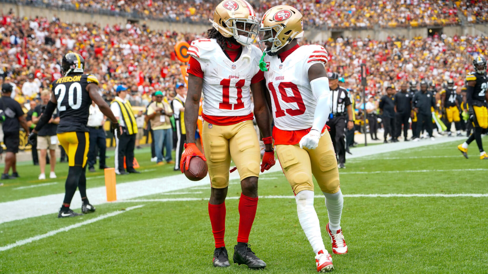 San Francisco 49ers wide receiver Deebo Samuel (19) congratulates San Francisco 49ers wide receiver Brandon Aiyuk (11)