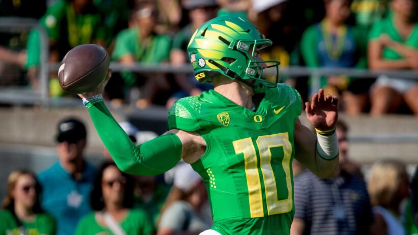Oregon quarterback Bo Nix throws out a pass