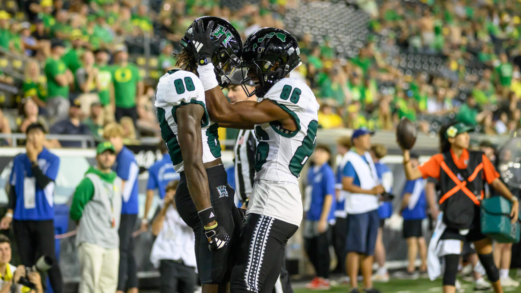 Hawaii celebrating a touchdown scored against Oregon in 2023