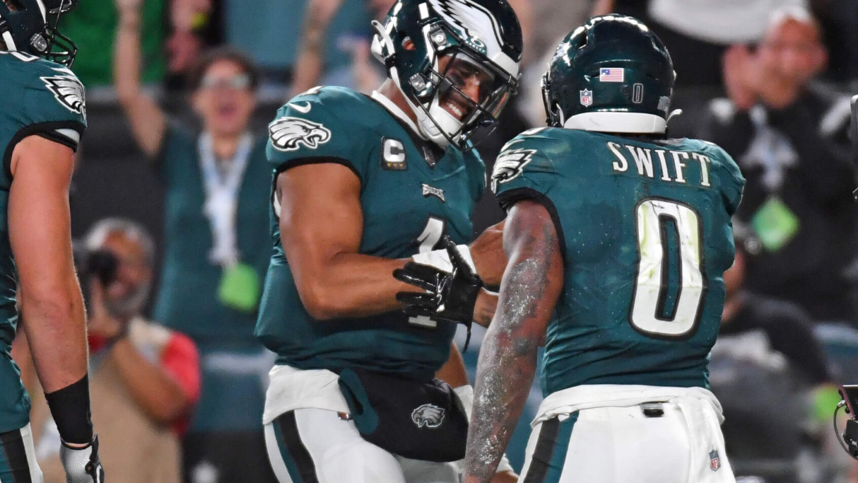 Philadelphia Eagles quarterback Jalen Hurts (1) and running back D'Andre Swift (0) celebrate touchdown