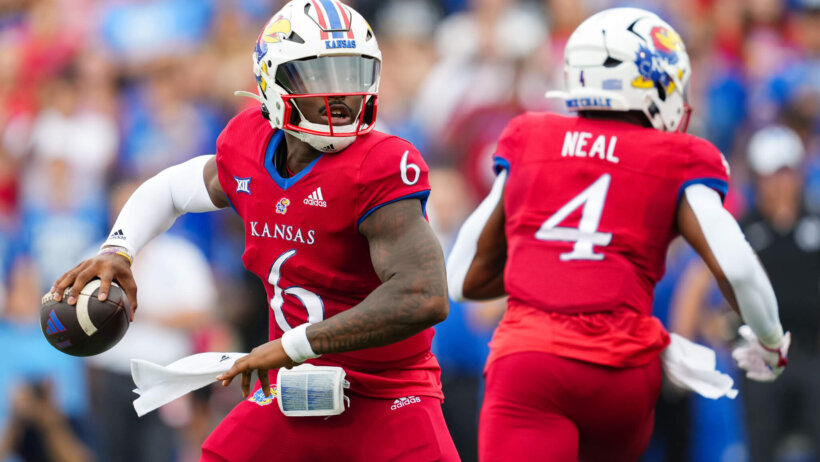 Kansas Jayhawks quarterback Jalon Daniels throws a pass