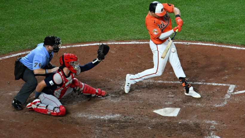 Baltimore Orioles first baseman Ryan Mountcastle at the plate swinging against the Boston Red Sox