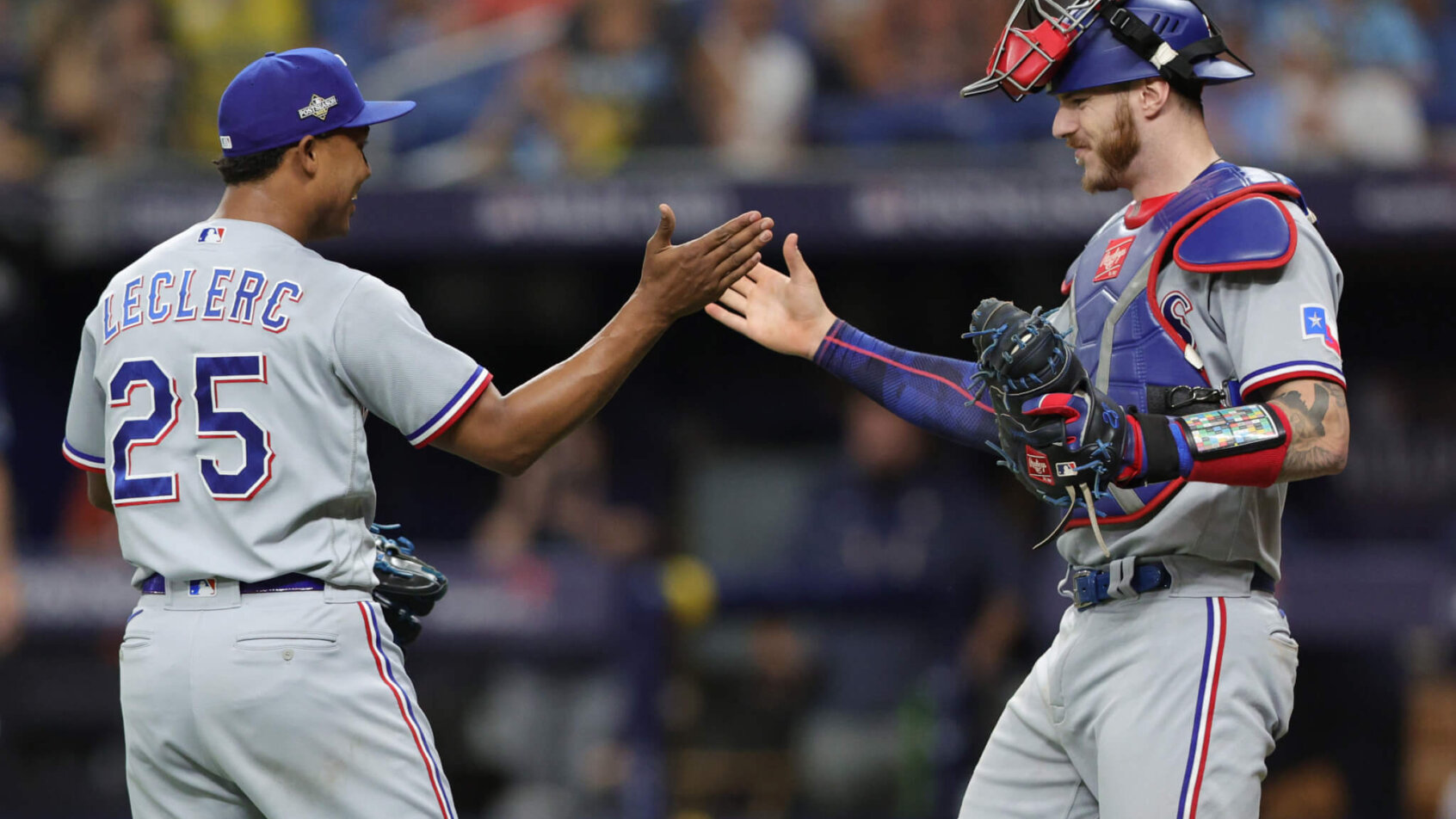 Texas Rangers relief pitcher Jose Leclerc celebrates with catcher Jonah Heim